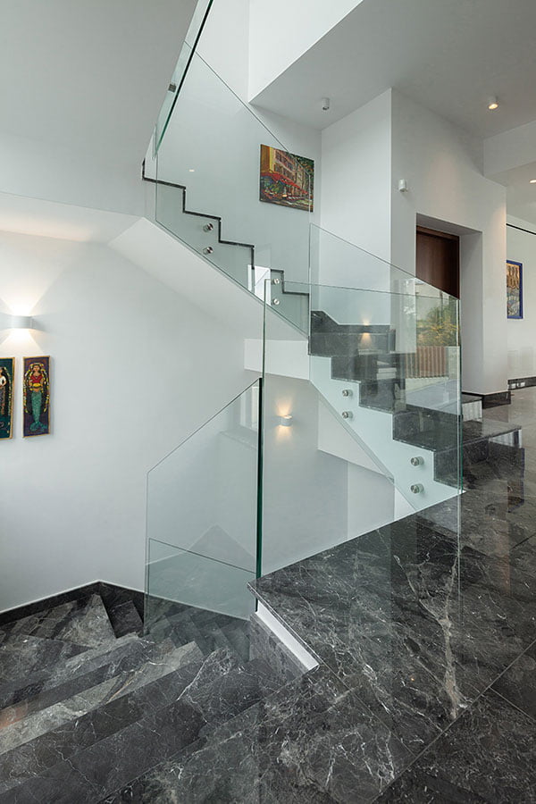 Marble flooring residential staircase with glass
