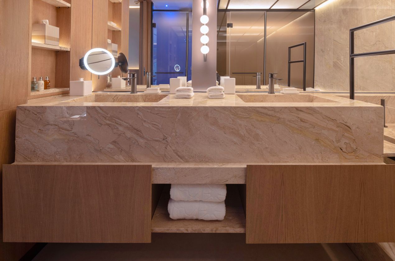 Daino reale marble double washbasin The custom washbasins seamlessly blend into the marble countertop
