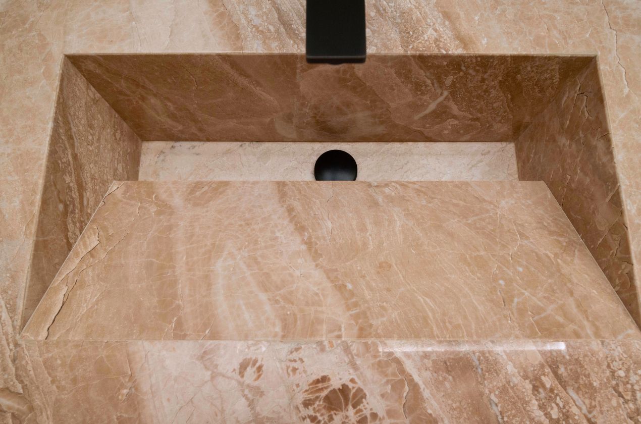 Daino reale marble washbasin closeup Daino reale marble washbasin closeup