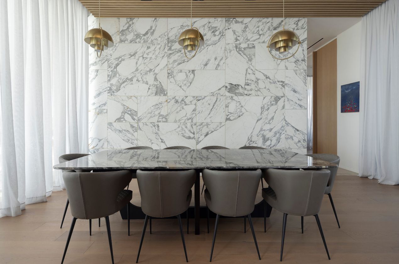 Arabescato marble wall with marble table