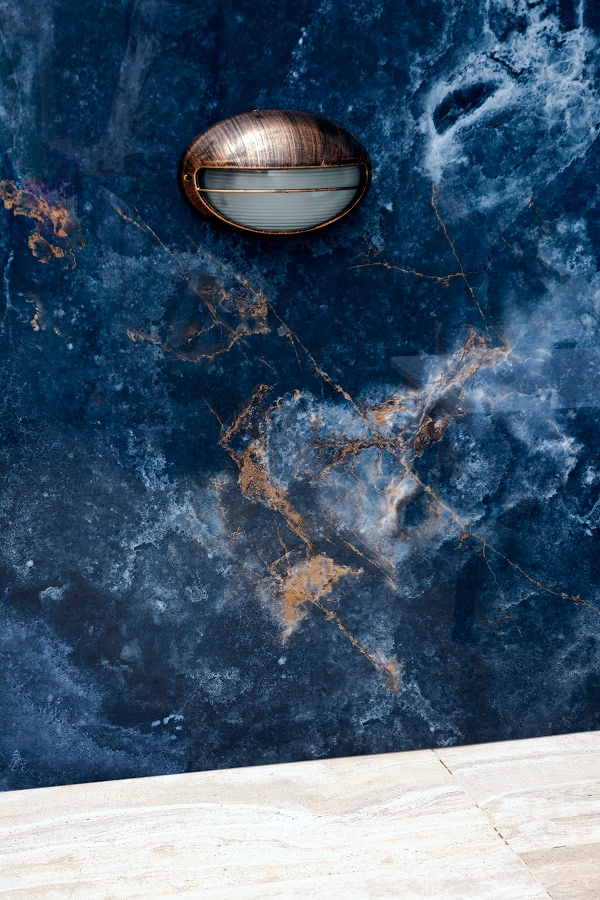 deep blue onyx effect surface with light fixture